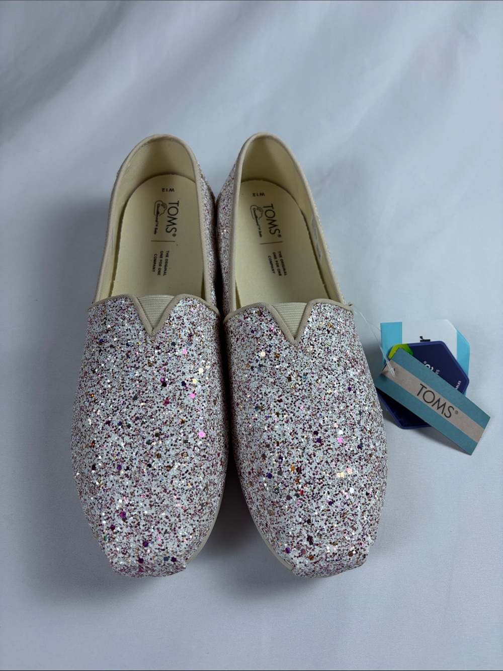 TOMS Glitter Slip-Ons in Pink and Silver